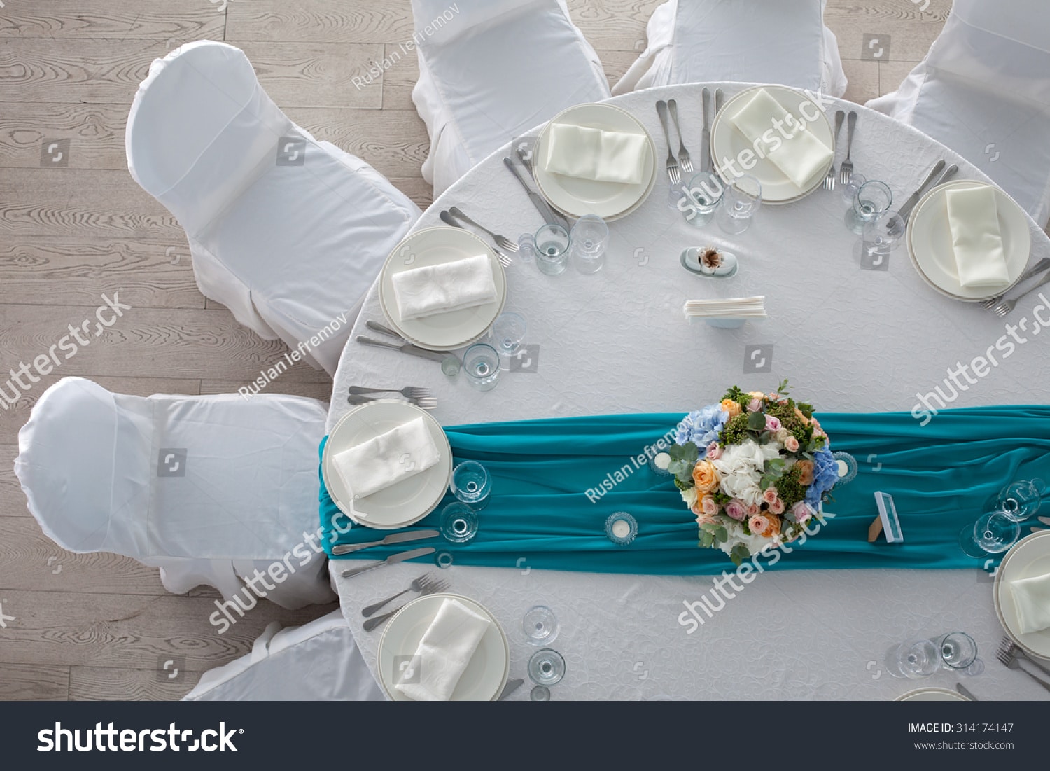 stock-photo-elegance-table-set-up-for-wedding-in-turquoise-top-view-314174147